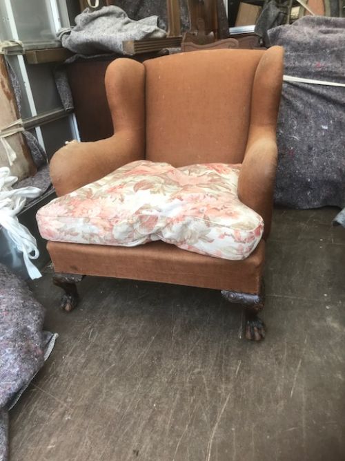 19thc oversized armchair standing on paw feet