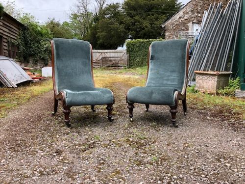 a pair of 19thc walnut slipper chairs