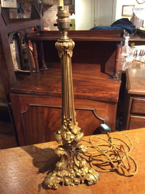 a 19thc gilt brass table lamp
