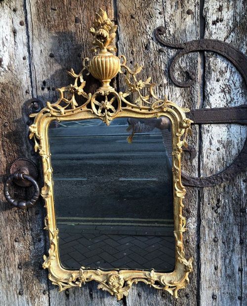 an 18thc continental carved and gilded mirror