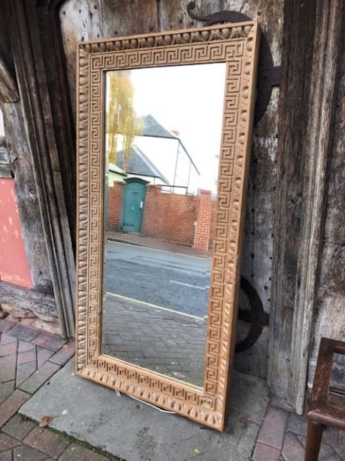 an 18thc carved pine bevelled mirror