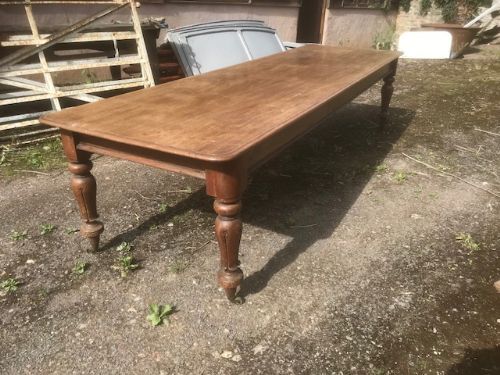 19thc mahogany 10ft refectory table with detail of carved flower on turned leg