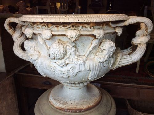 a 19thc cast iron warwick vase on its plinth
