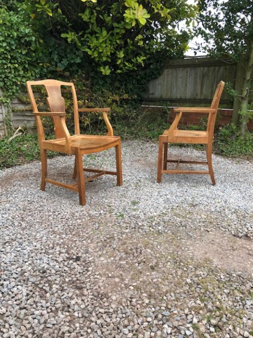 a pair of 1930s heals light oak armchairs