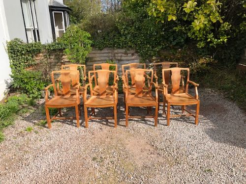 a set of 8 heals light oak armchairs