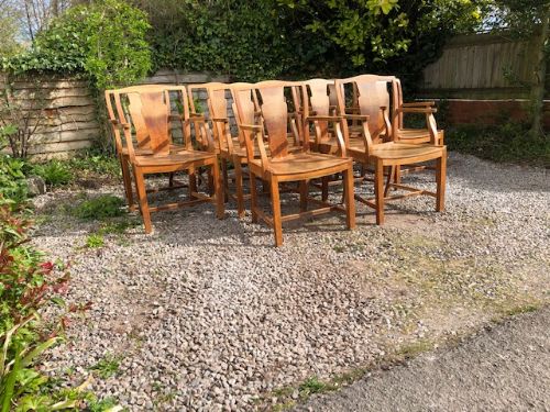 a set of 10 heals light oak armchairs