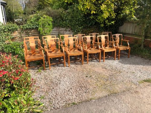 a set of 12 heals light oak armchairs