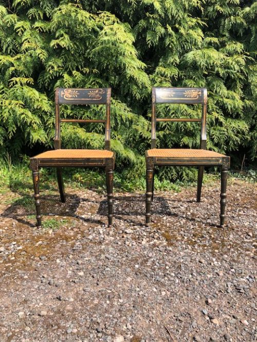 a pair of early 19thc painted side chairs