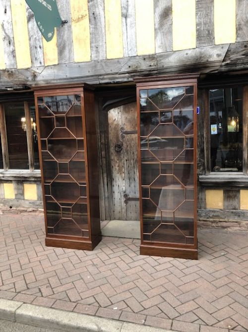 a pair of howard and sons mahogany astragal glazed bookcase c1900