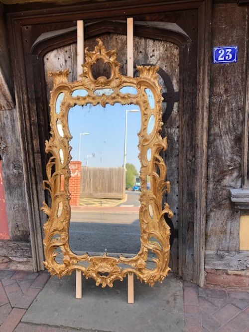 a large 18th century carved and gilded mirror