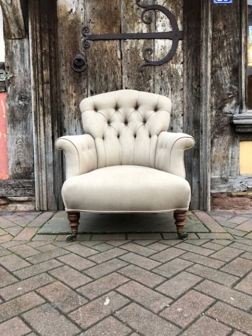 a 19th century howard and sons upholstered button back mahogany armchair