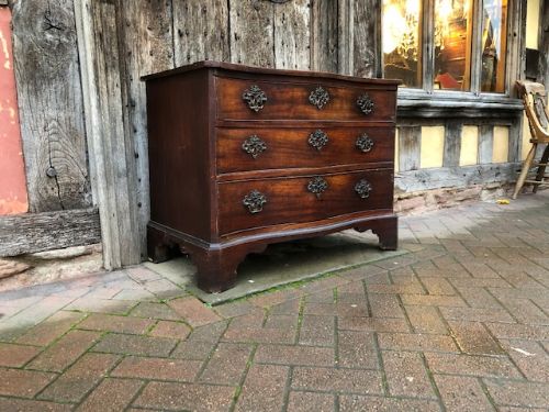 an 18thc george ii mahogany serpentine chest of drawers