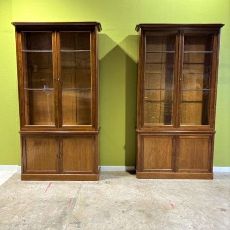 a pair of 19th century mahogany two door bookcases with bronze glazing bars