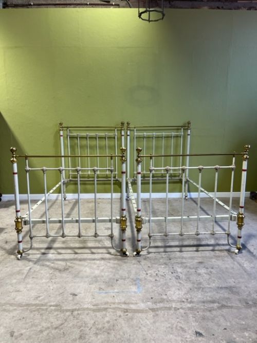 a pair of 19th century brass and iron single beds