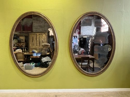 a pair of 66 19th century country house oval mirrors