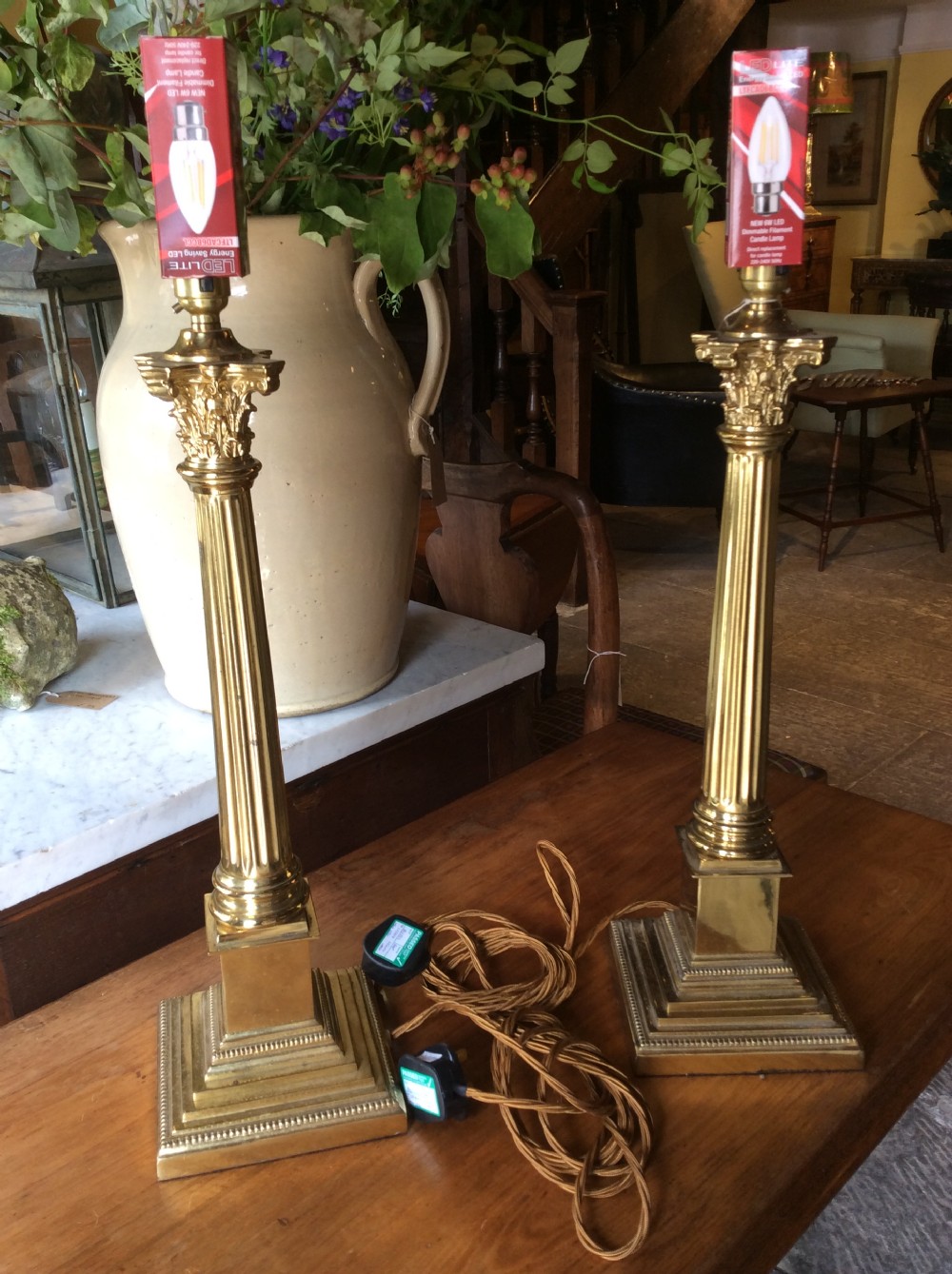 early 20thc pair of corinthian column brass lamps