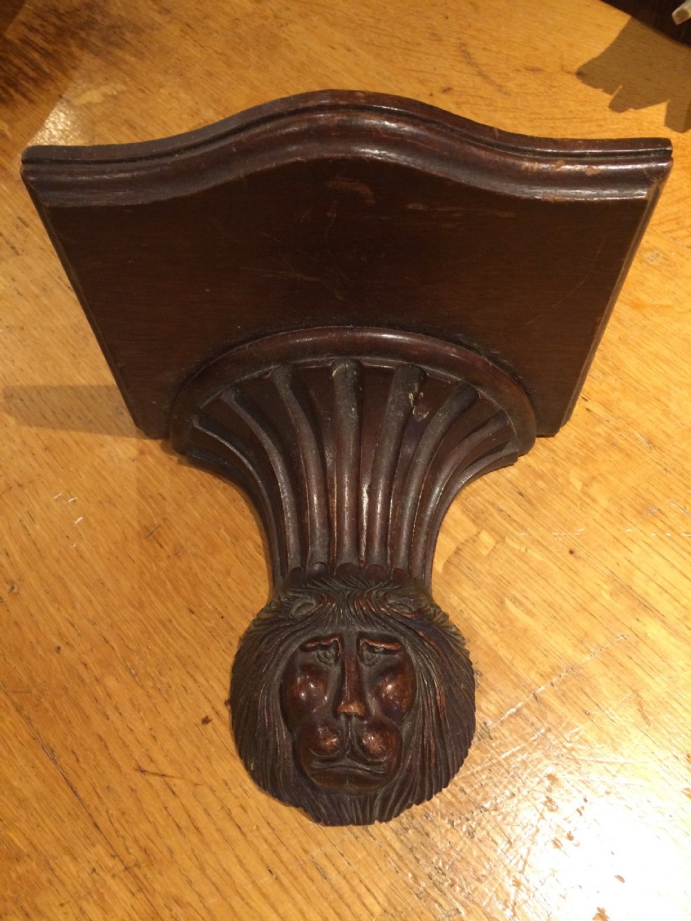 19thc mahogany wall bracket with carved stylized lions head