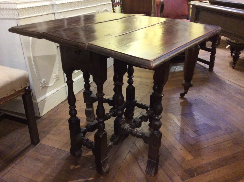 late 17thc elm gateleg table with broganza feet c 1680