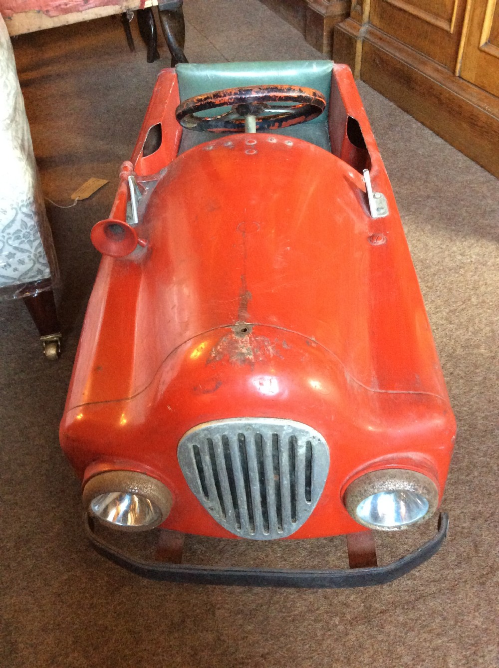 vintage red tin pedal car