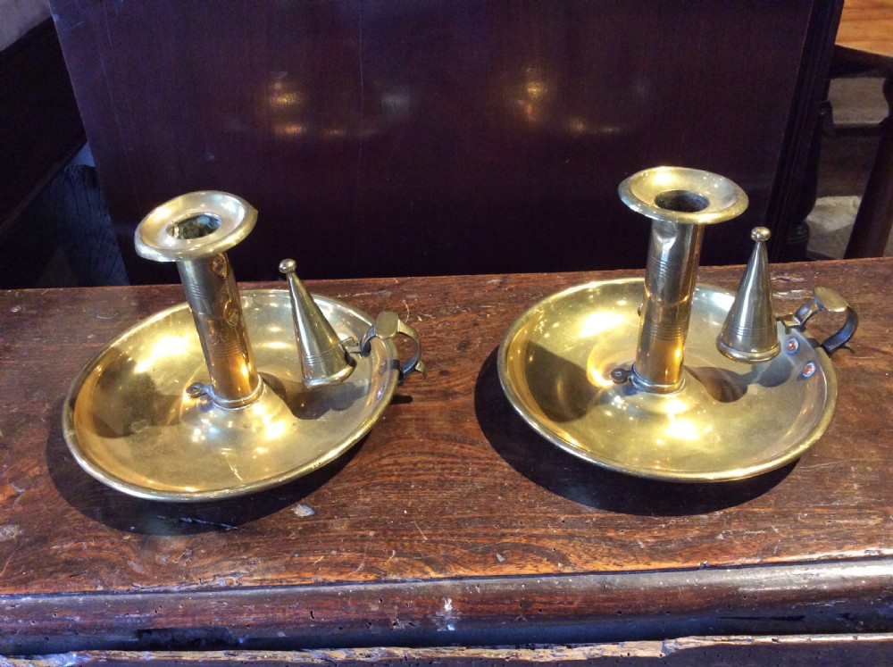 pair of push up brass candle sticks holders with snuffers