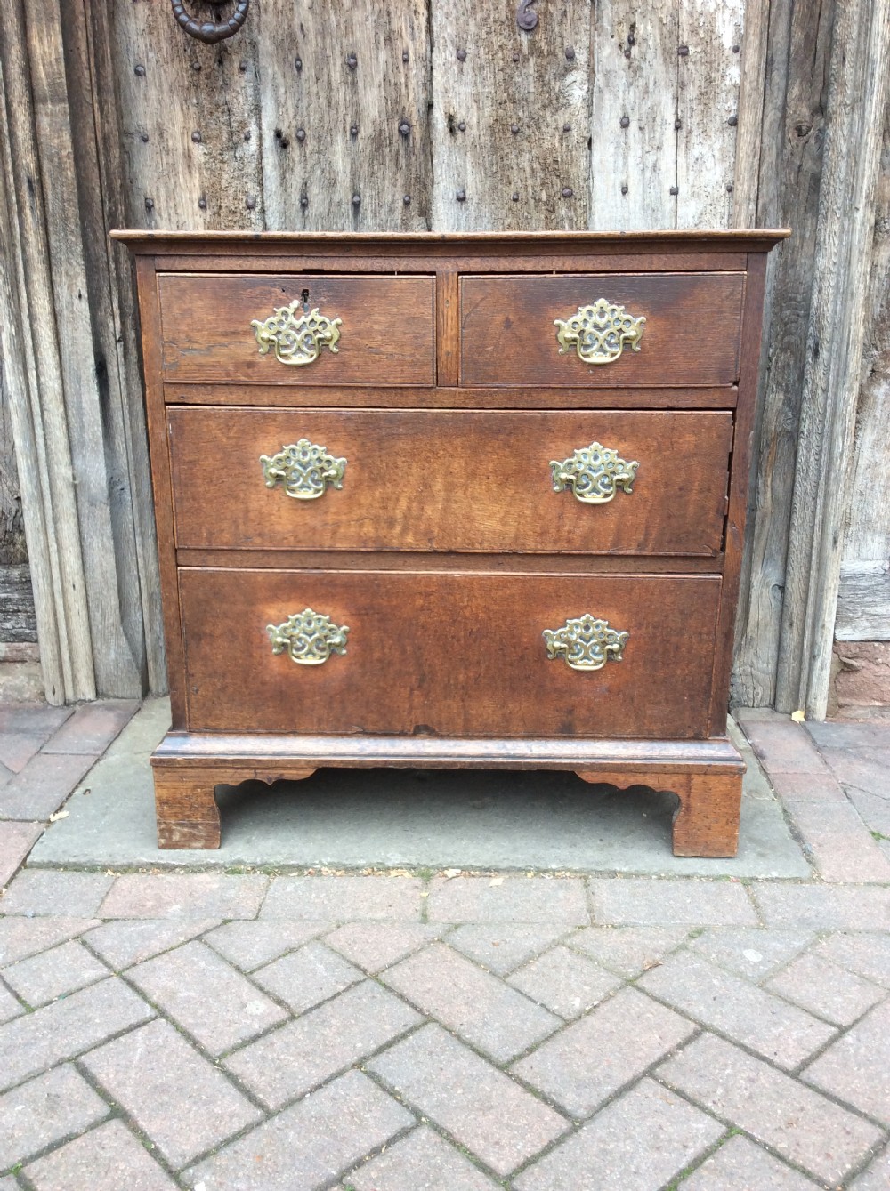 18thc oak small chest of 4 drawers on bracket feet