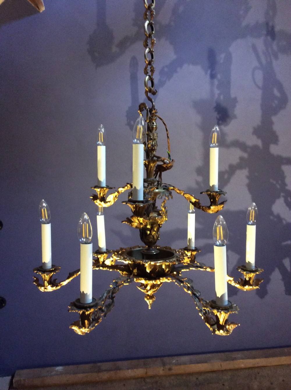 a 9 branch gilt brass chandelier