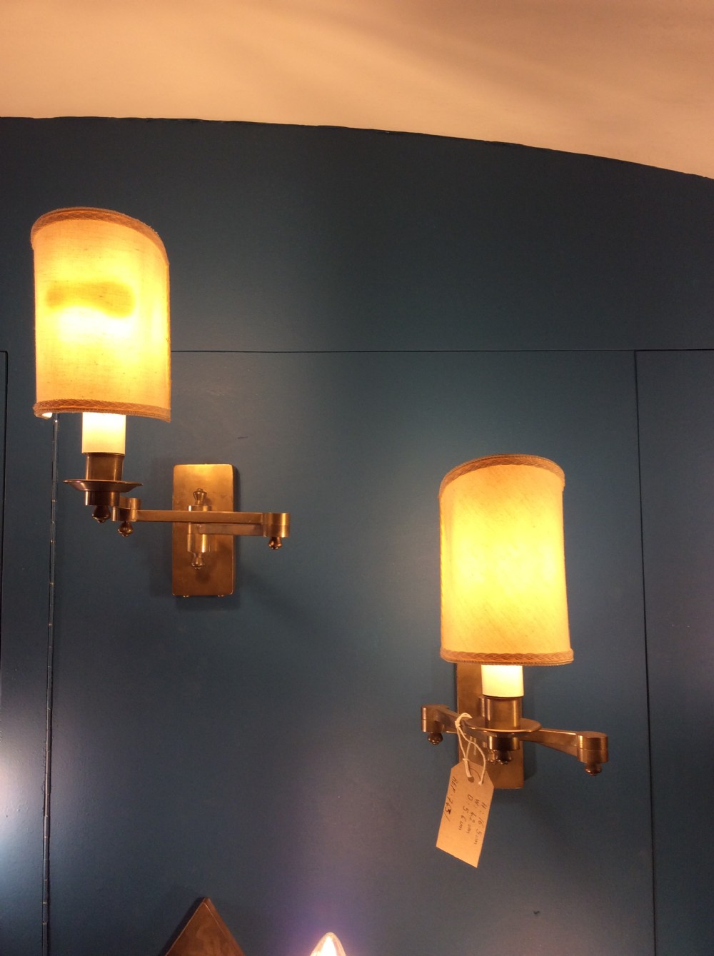 a pair of extending brass wall lights