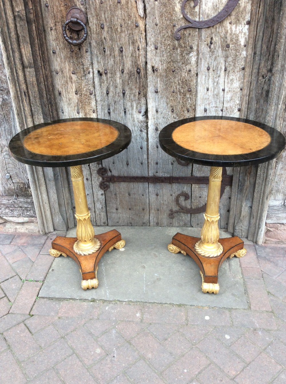 a pair of 19thc amboyna ebony and parcel gilt tables