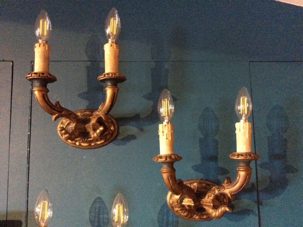 a pair of 19thc carved decorated wall light brackets