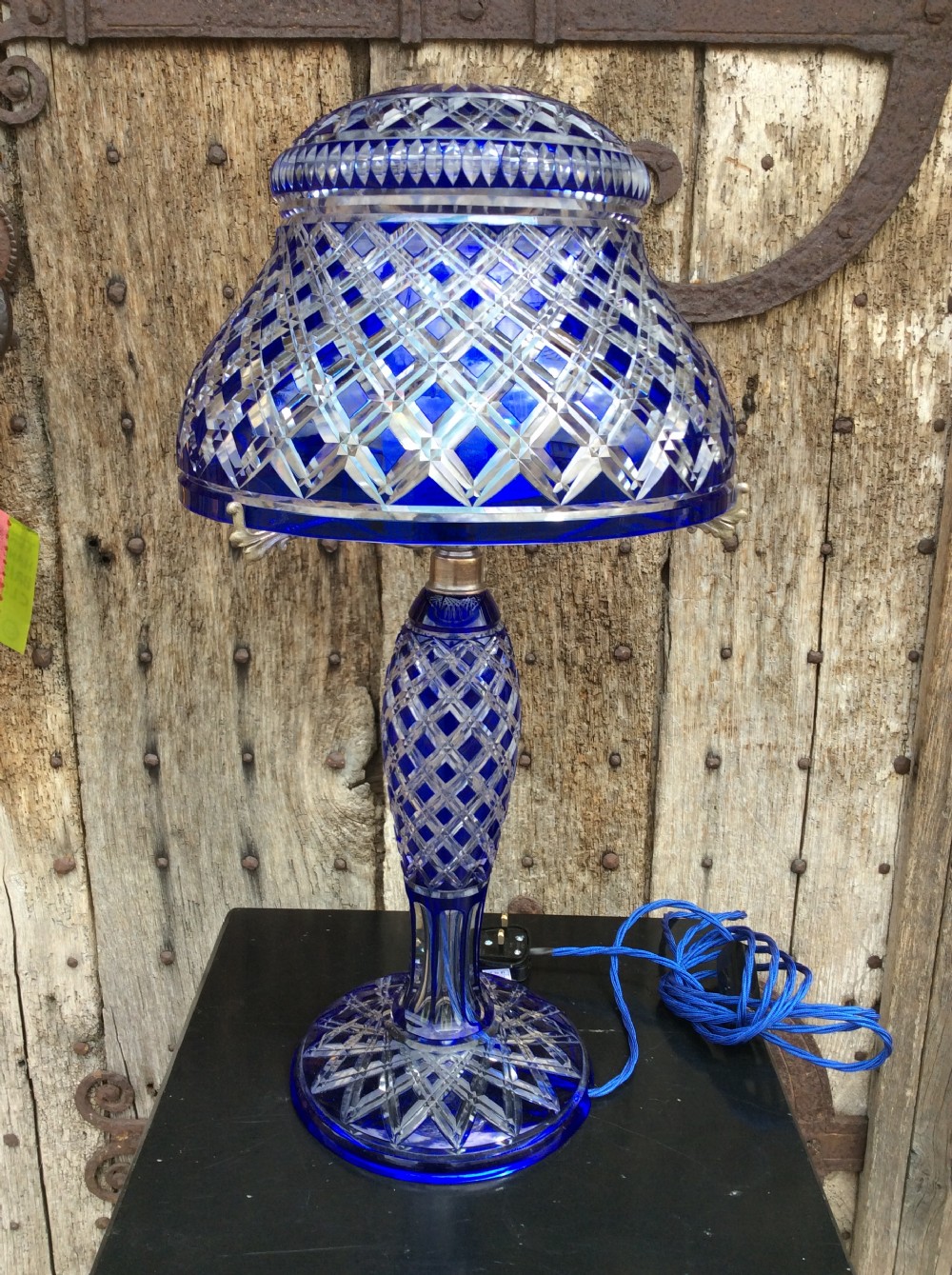 a blue overlay cut glass table lamp