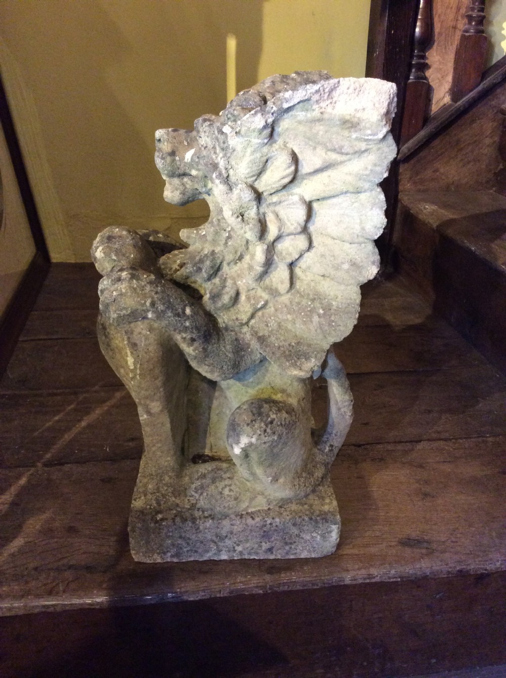 a 19thc carved stone griffin
