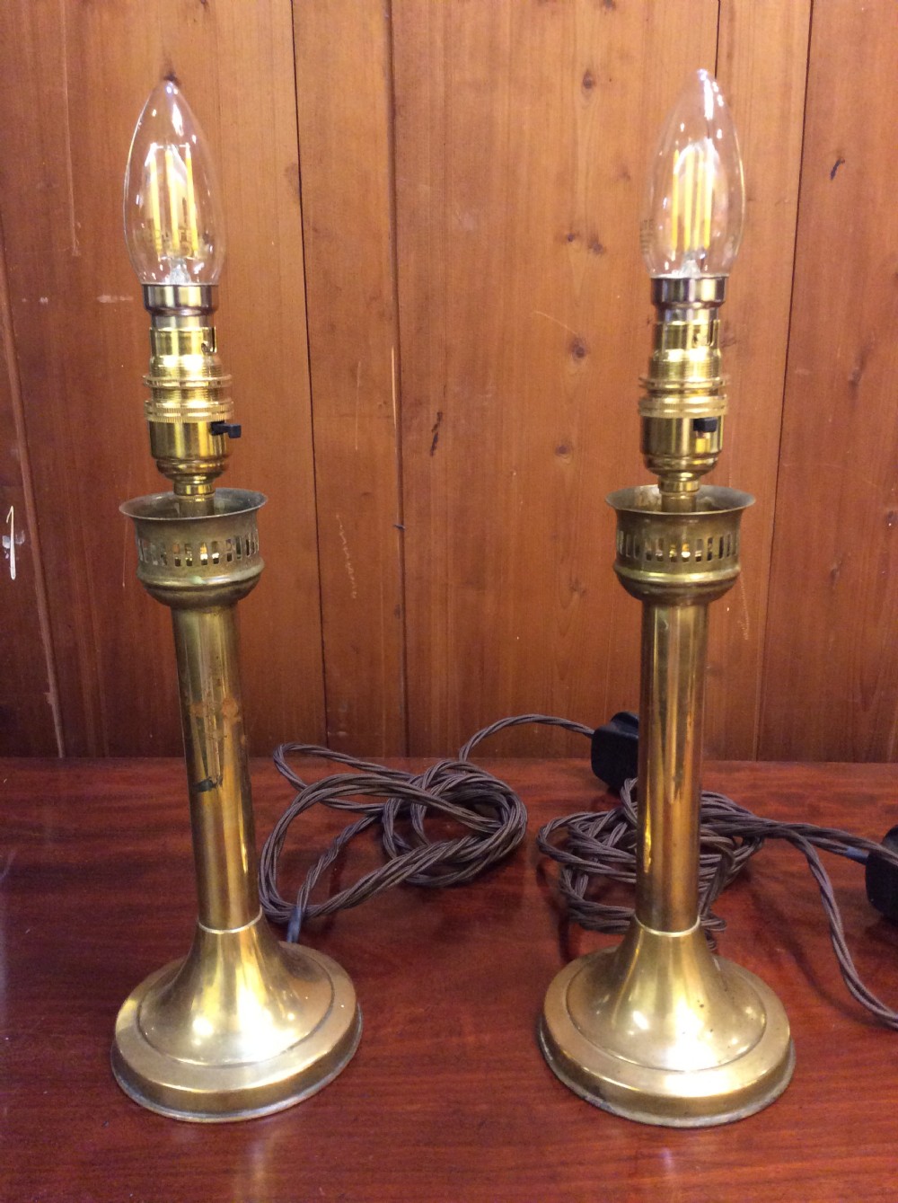 a pair of edwardian brass table lamps