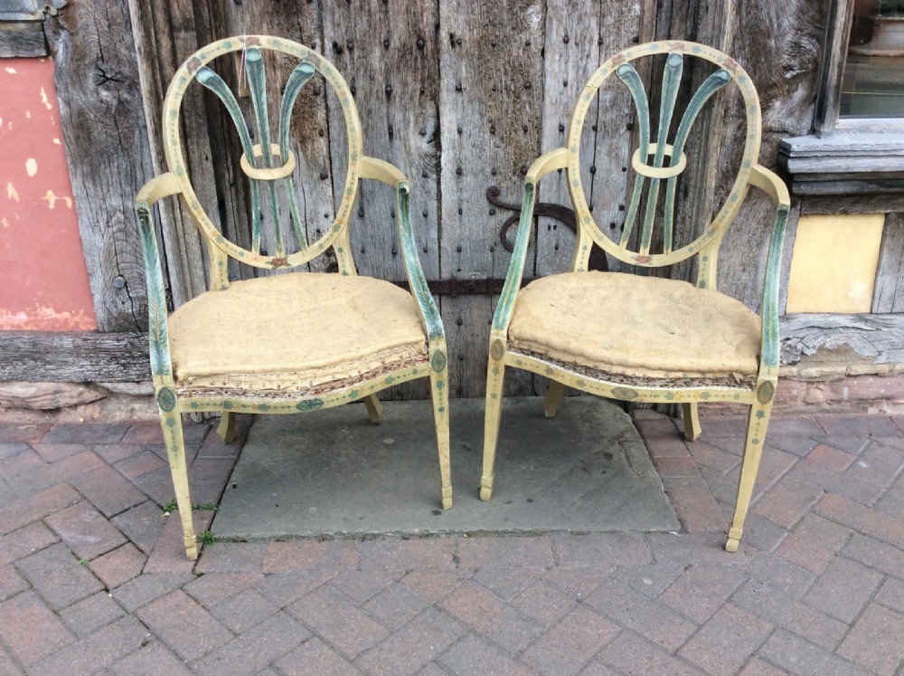 pair of 19th c painted open arm armchairs with prince of wales feathers shaped back