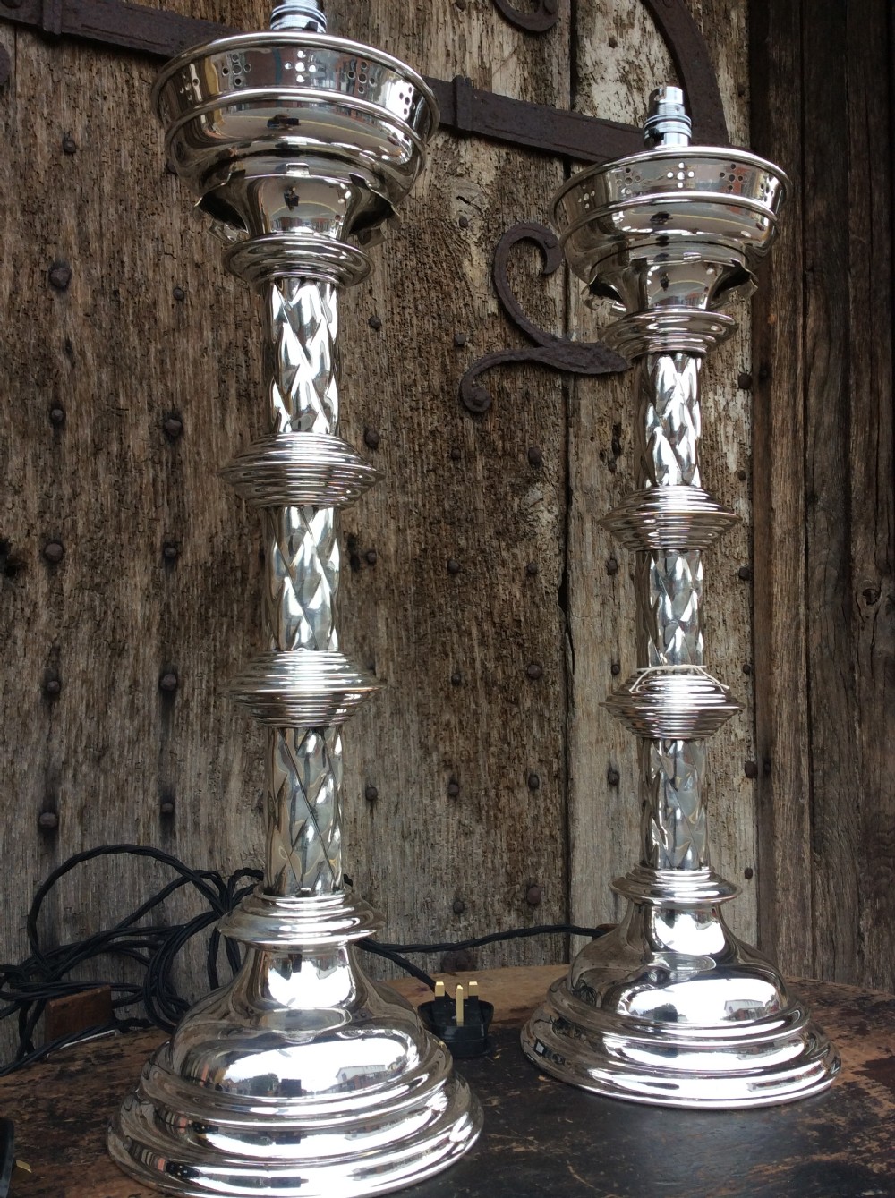 a pair of edwardian silverplated converted gothic candlesticks