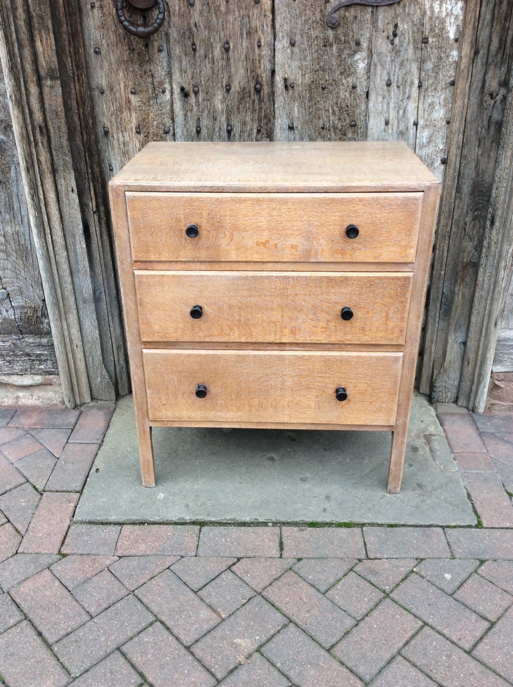 a 20thc pale oak heals chest of drawers