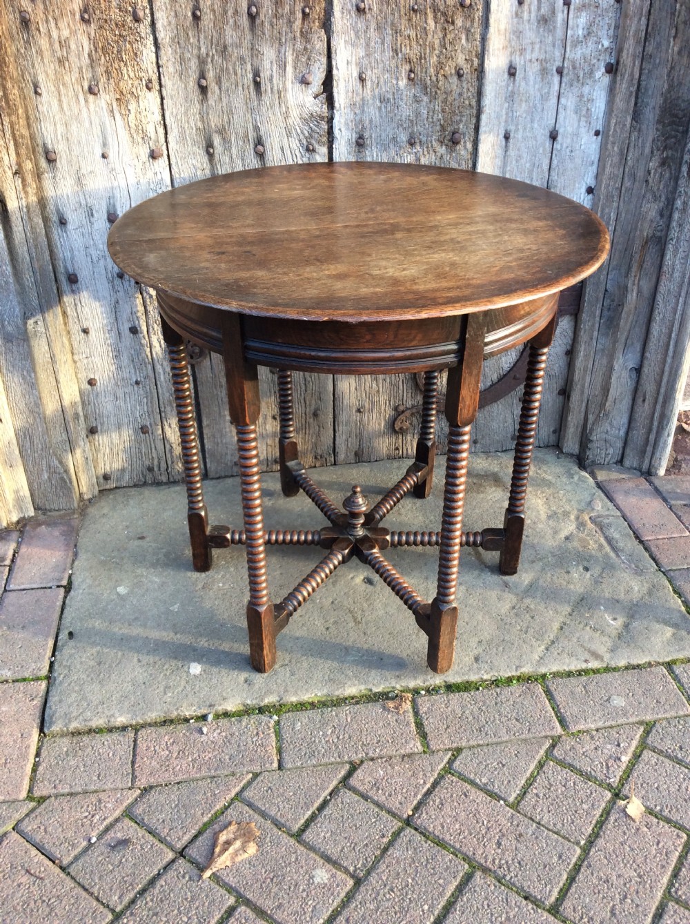an edwardian oak 6 legged lamp table