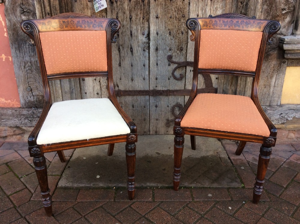 a pair of regency rosewood holly inlaid chairs attributed to george bullock