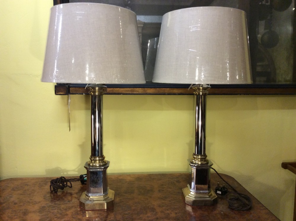 a pair of chrome and brass 1950s table lamps