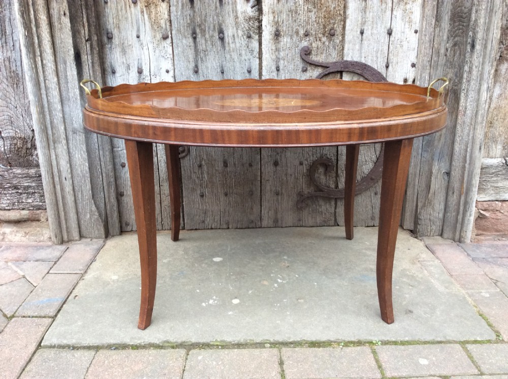 an 18thc mahogany oval tray on later stand