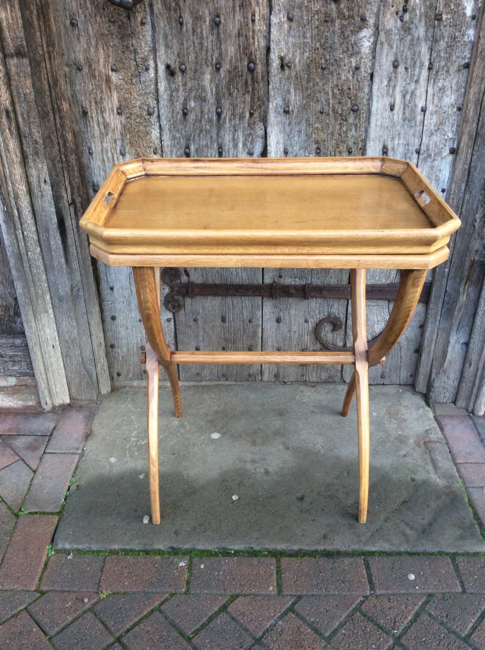 an early 20thc light oak buttlers tray with its stand