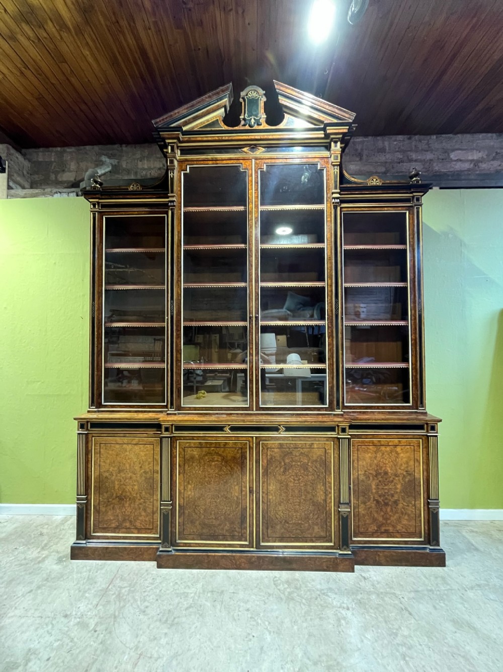 a 19th century burr walnut display cabinetbookcase