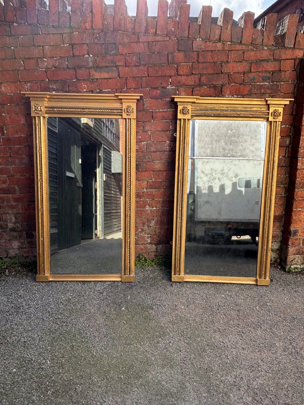 close pair of geo iv carved giltwood pier mirrors