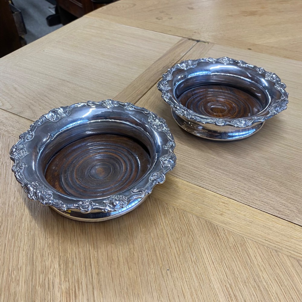 late 19th century silver plate wine bottle coasters